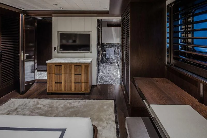 a room with a tv and a table aboard ATLANTE Yacht for Sale