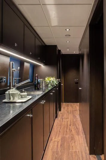 a kitchen with a wood floor aboard ATLANTE Yacht for Sale