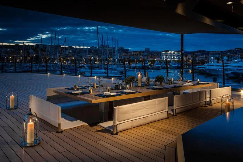 a large room with a view of a city at night aboard ATLANTE Yacht for Sale