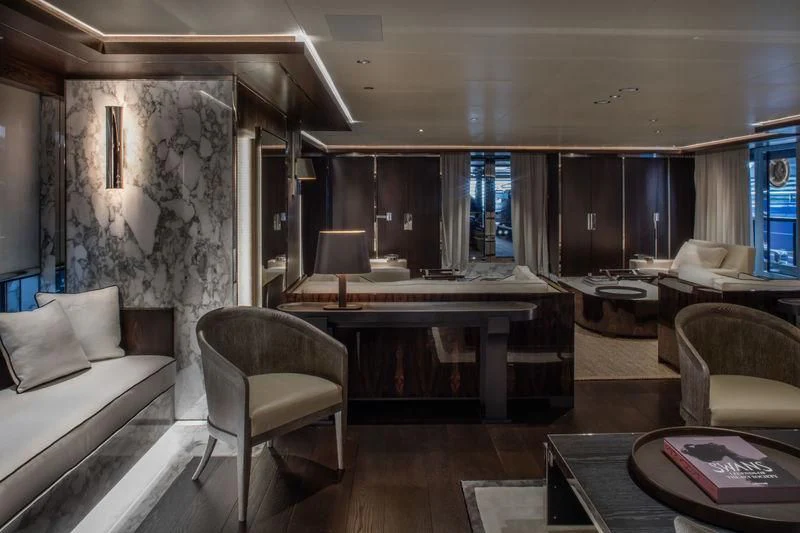 a room with a couch and a table and chairs aboard ATLANTE Yacht for Sale
