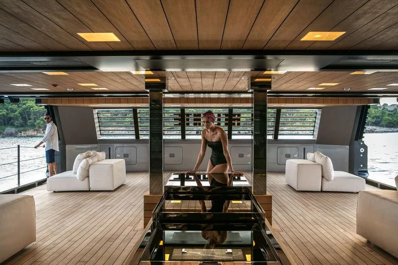 a person standing on a deck aboard ATLANTE Yacht for Sale