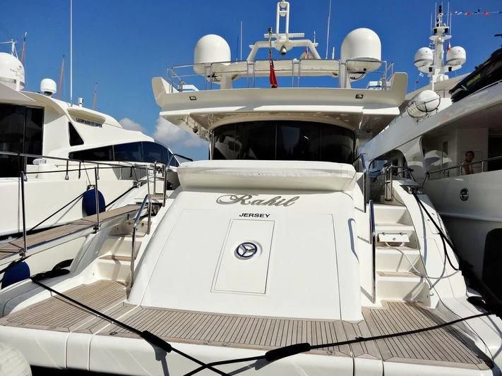 a white boat with a white sail aboard RAHIL Yacht for Sale