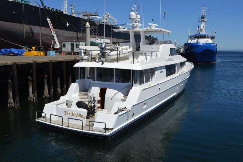 a couple of boats docked at a pier aboard LEGEND Yacht for Sale