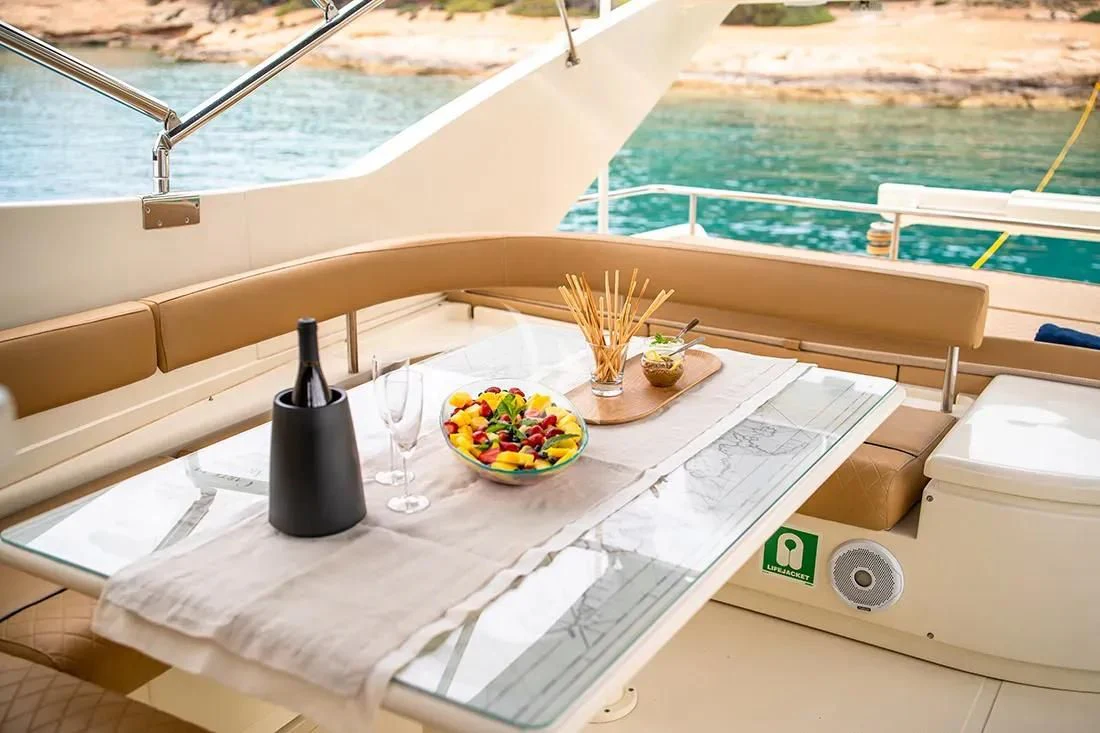 a boat with a table and chairs aboard BELLAS BOY Yacht for Sale