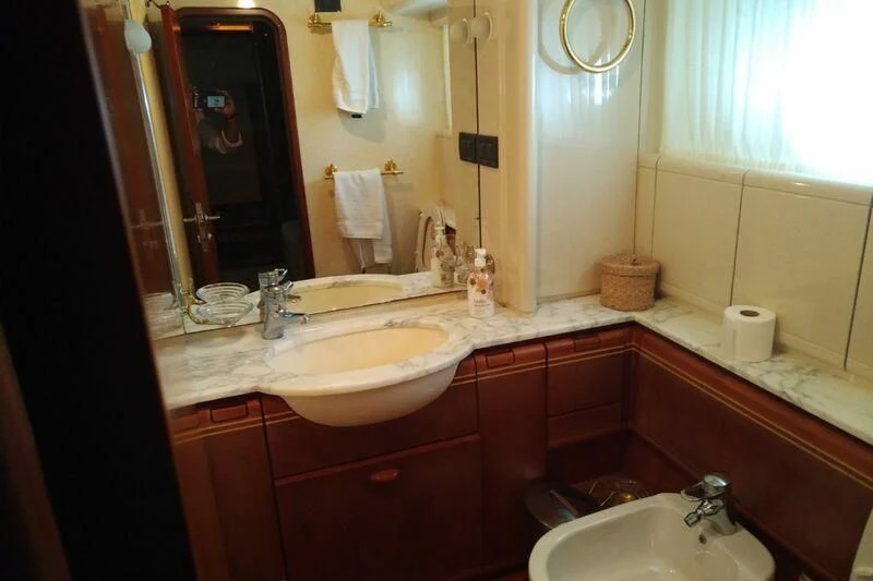 a bathroom with red cabinets aboard BELLAS BOY Yacht for Sale