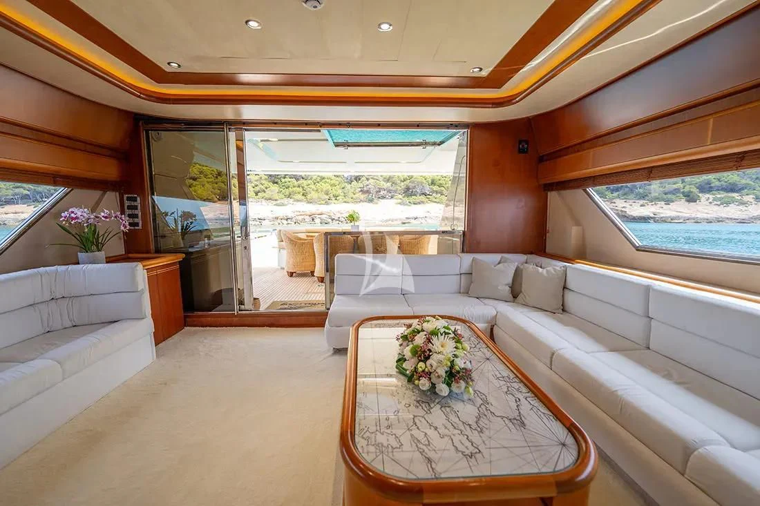 a living room with a large window aboard BELLAS BOY Yacht for Sale