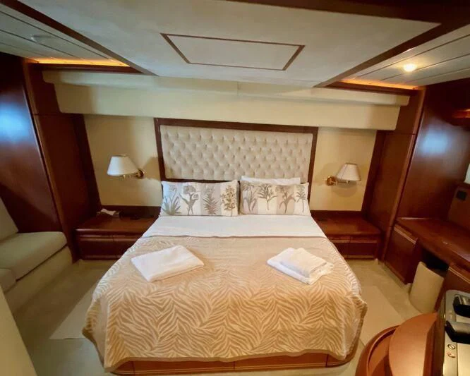 a bed with a white sheet aboard BELLAS BOY Yacht for Sale