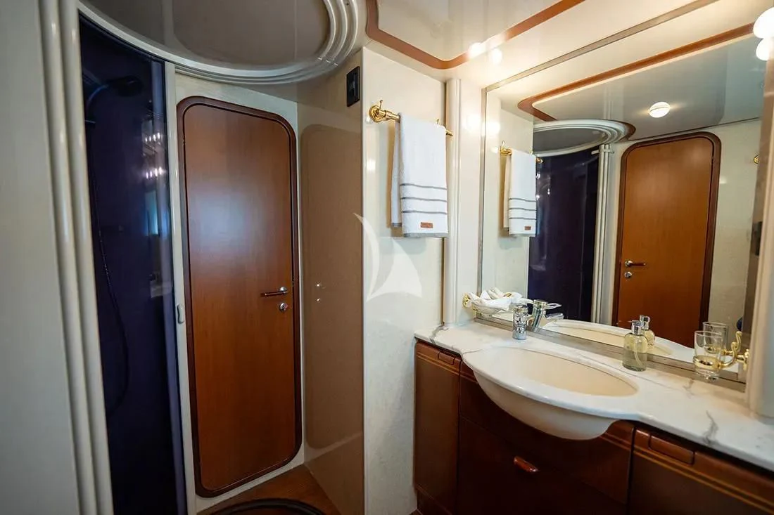 a bathroom with a sink and a mirror aboard BELLAS BOY Yacht for Sale