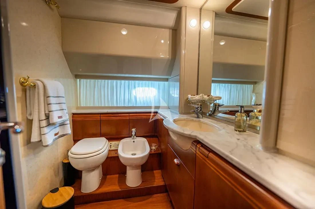 a bathroom with a toilet and a sink aboard BELLAS BOY Yacht for Sale