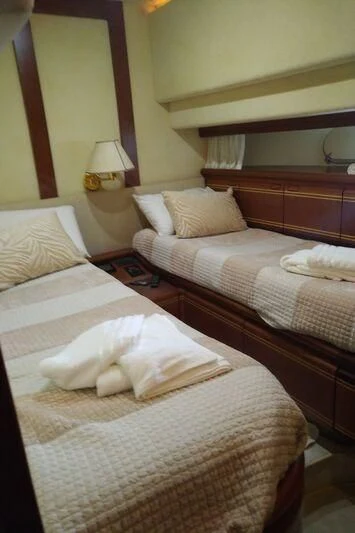 a couple of beds in a hotel room aboard BELLAS BOY Yacht for Sale