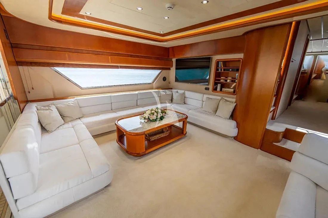 a living room with a couch and a table aboard BELLAS BOY Yacht for Sale
