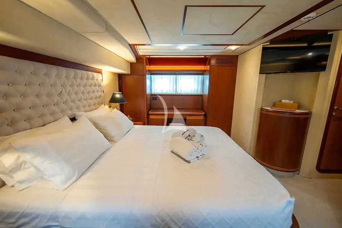 a bed with white sheets aboard BELLAS BOY Yacht for Sale