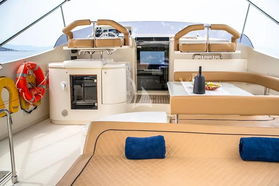 a room with a bed and a table aboard BELLAS BOY Yacht for Sale