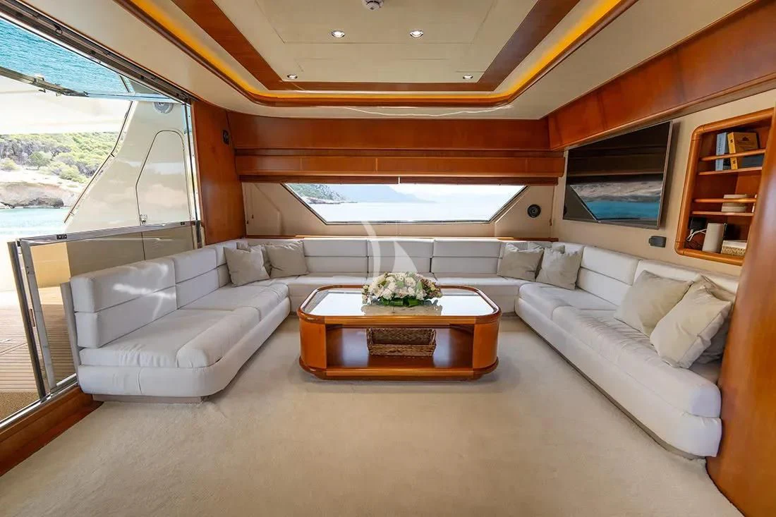 a living room with a couch and a table aboard BELLAS BOY Yacht for Sale