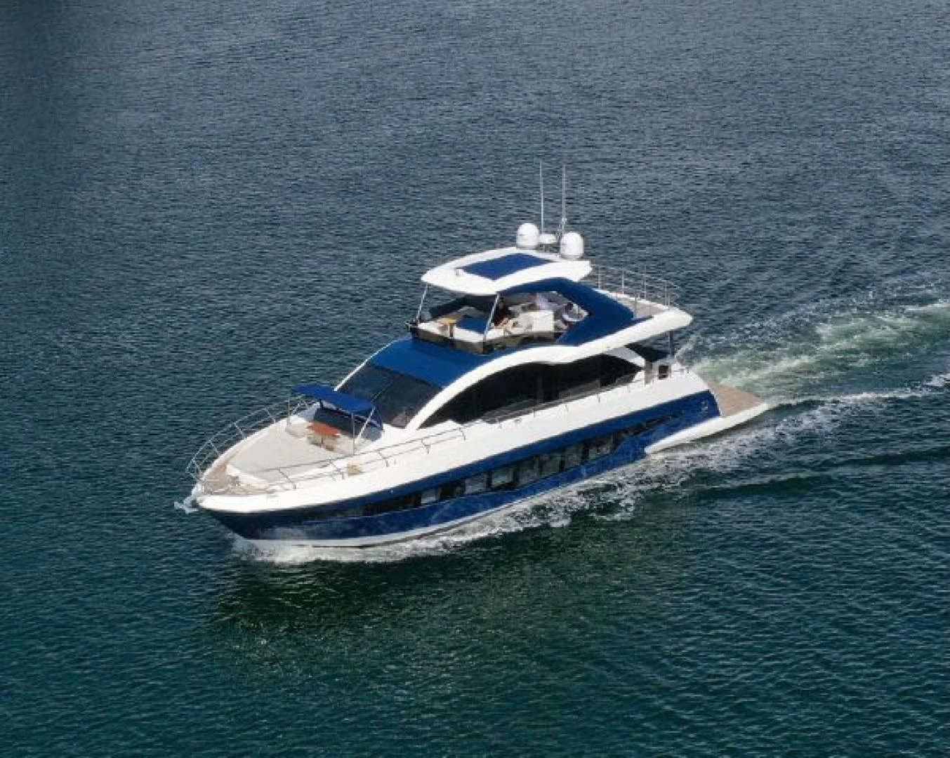 a boat on the water aboard THE ONLY BLUE 66 FLY Yacht for Sale