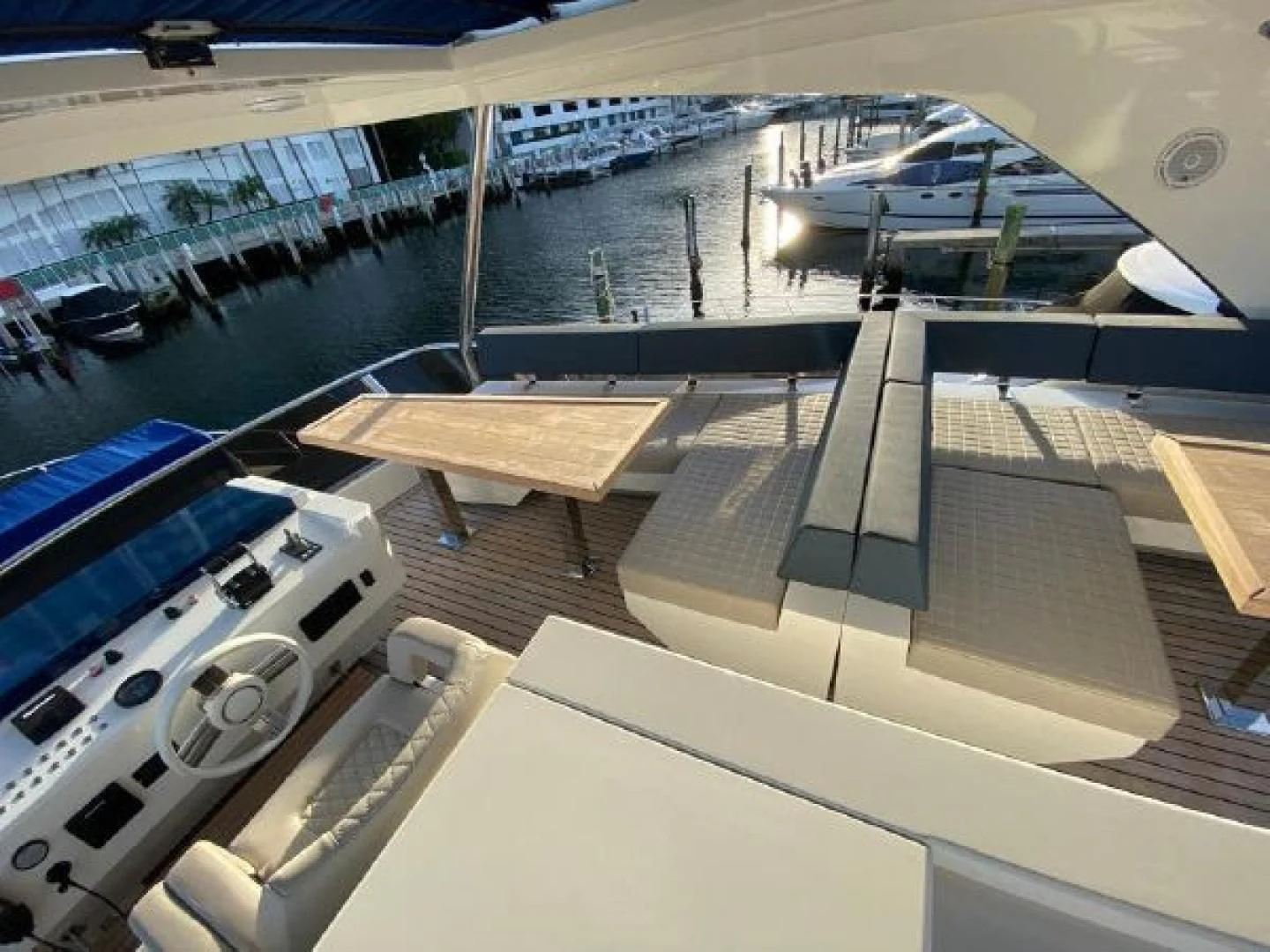 a view of a deck of a ship and a boat in the water aboard THE ONLY BLUE 66 FLY Yacht for Sale