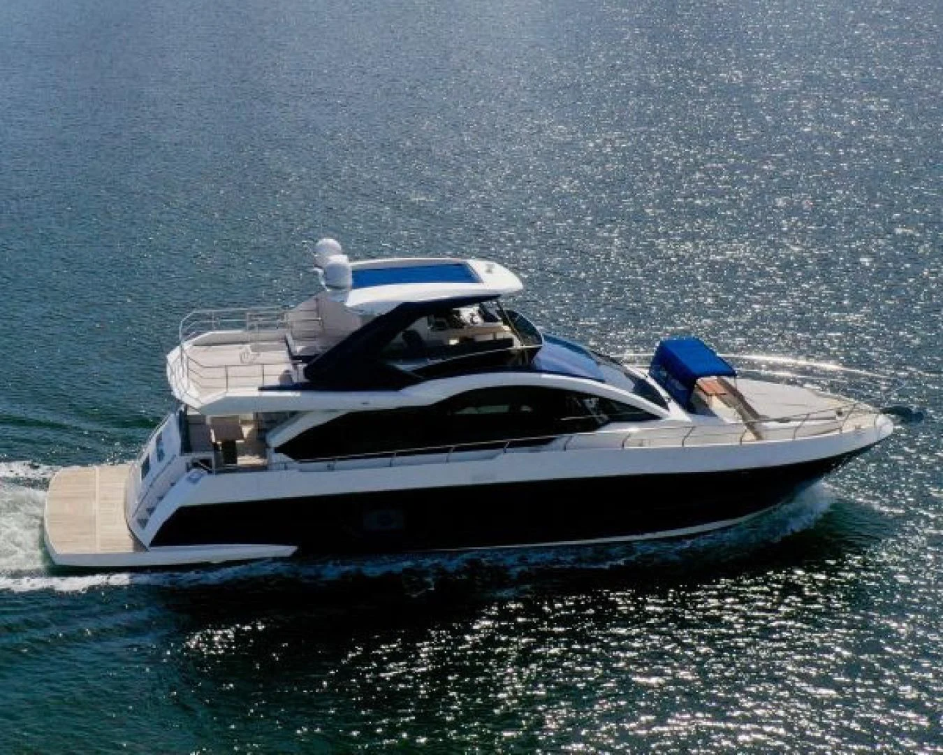 a boat in the water aboard THE ONLY BLUE 66 FLY Yacht for Sale