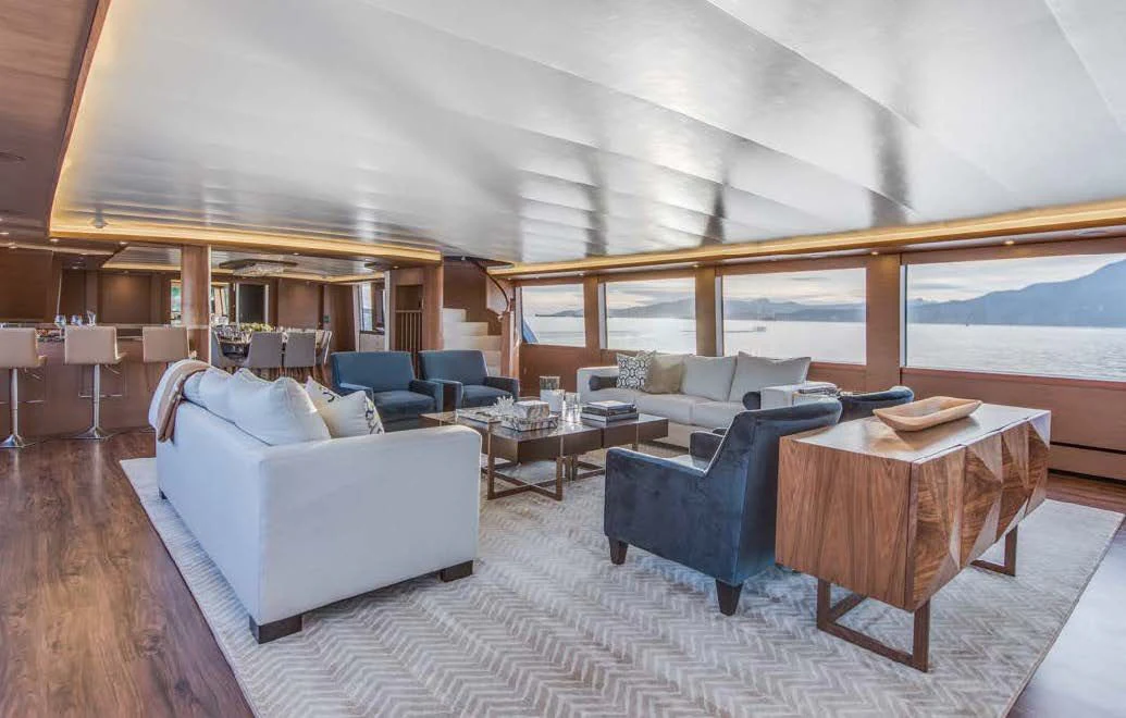 a living room with a couch and a table aboard ASCENTE Yacht for Charter