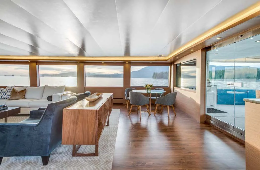 a room with a wood floor and a large window with a wood floor aboard ASCENTE Yacht for Charter