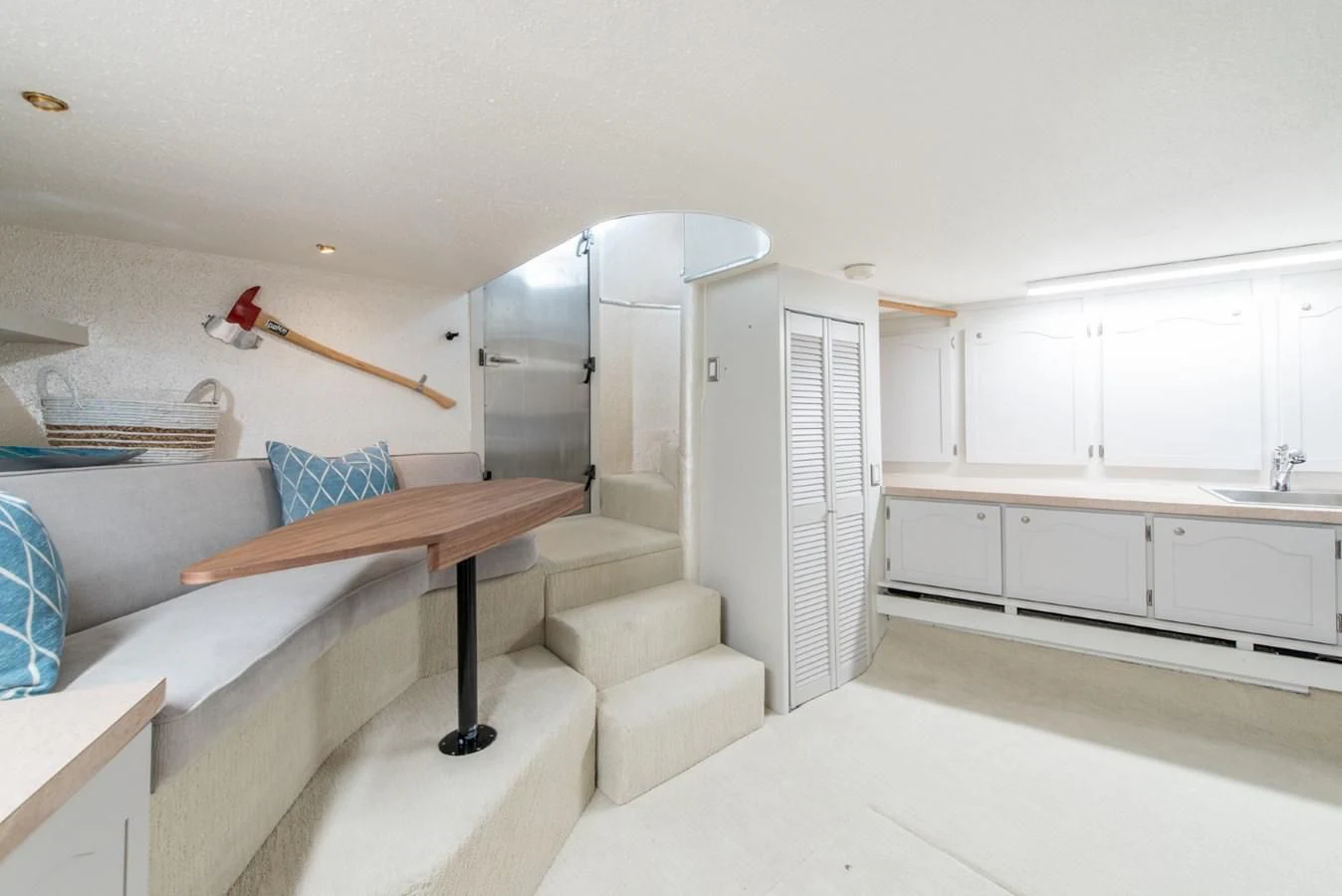 a room with a bed and a table aboard ASCENTE Yacht for Charter