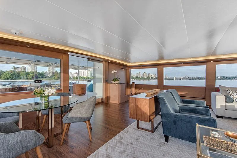 a living room with a large window aboard ASCENTE Yacht for Charter