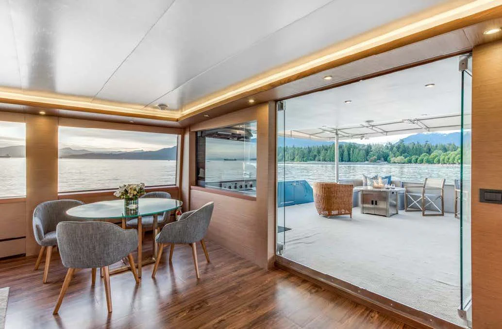 a large room with a table and chairs aboard ASCENTE Yacht for Charter