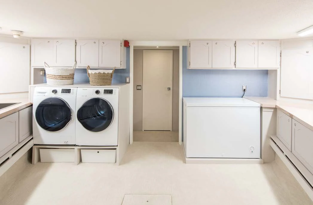 a laundry room with a washing machine aboard ASCENTE Yacht for Charter