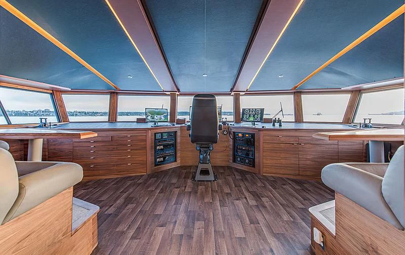 a room with a large window and a wood floor aboard ASCENTE Yacht for Charter
