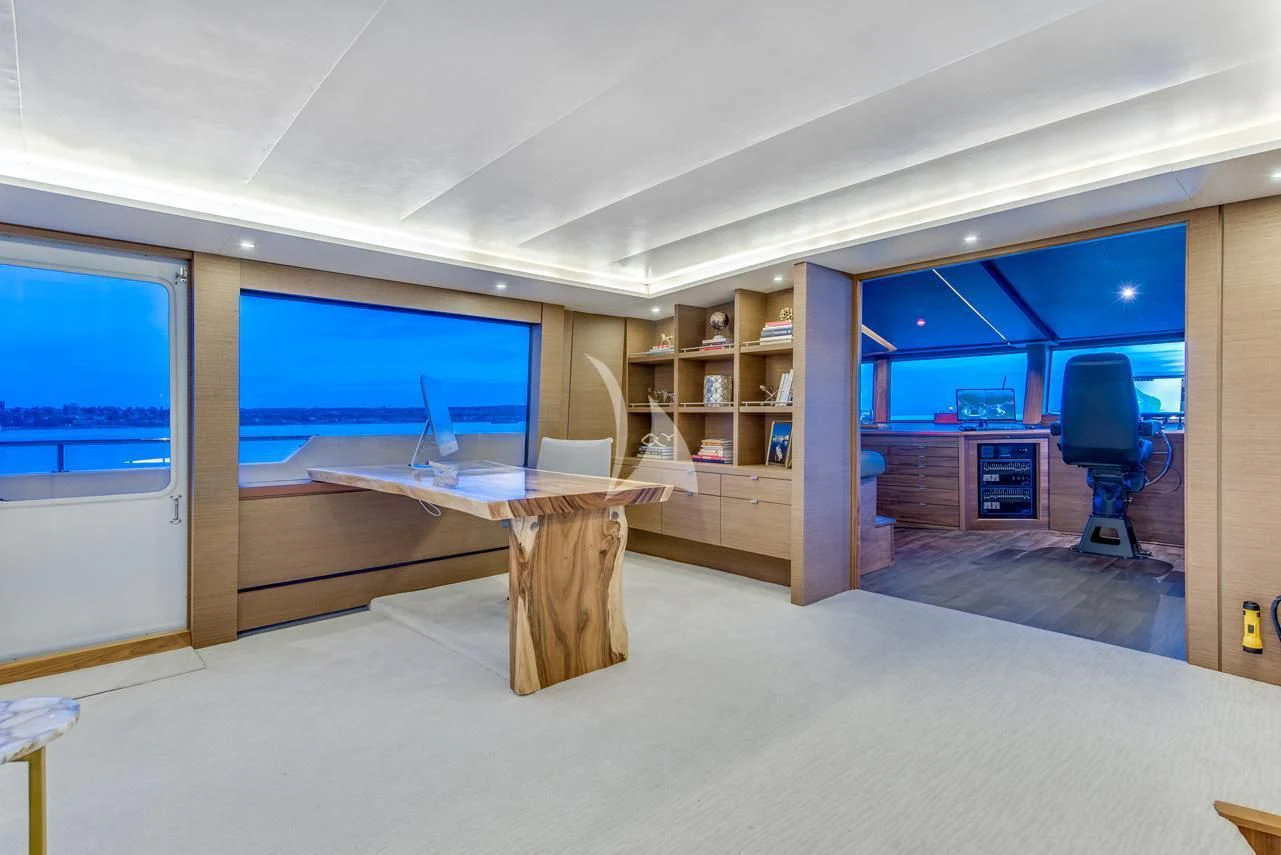 a room with a desk and a computer aboard ASCENTE Yacht for Charter