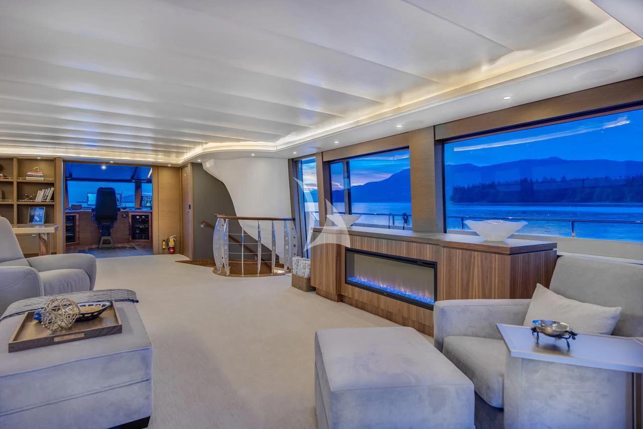 a living room with a large window aboard ASCENTE Yacht for Charter