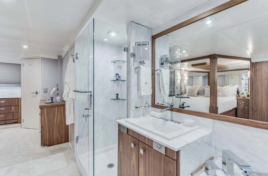 a bathroom with a large mirror aboard ASCENTE Yacht for Charter
