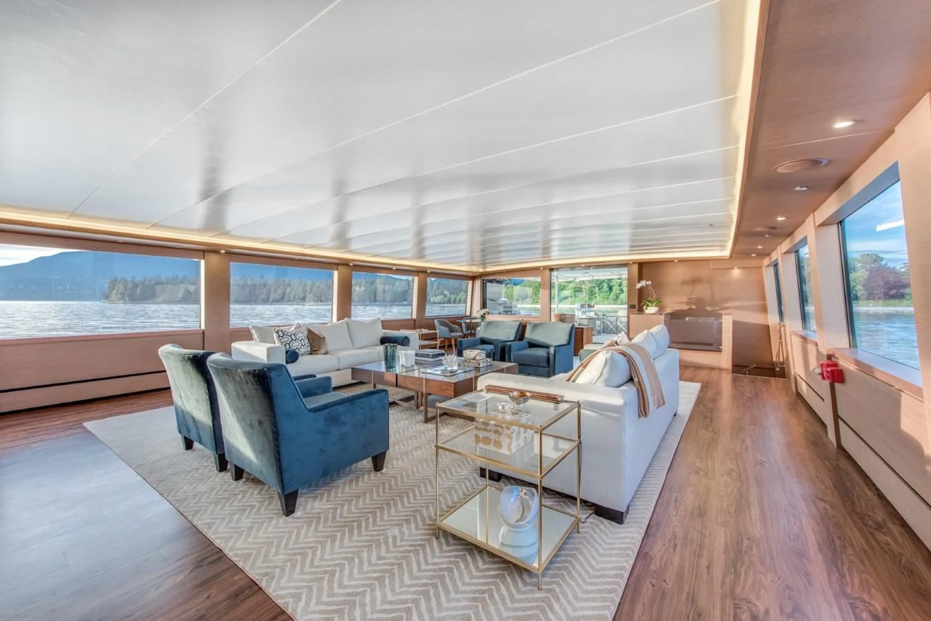 a large living room with a large window aboard ASCENTE Yacht for Charter