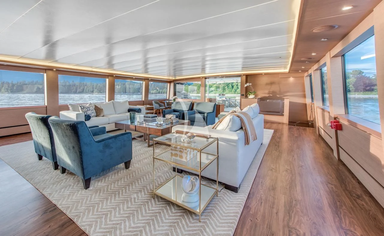 a living room with a large window aboard ASCENTE Yacht for Charter