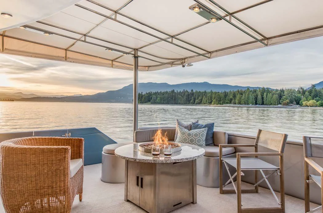 a table and chairs on a patio aboard ASCENTE Yacht for Charter
