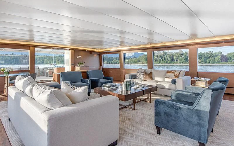 a living room with a large window aboard ASCENTE Yacht for Charter