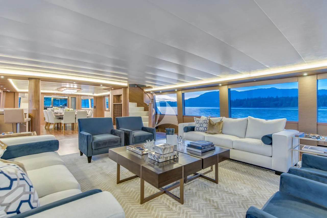 a living room with a large window aboard ASCENTE Yacht for Charter