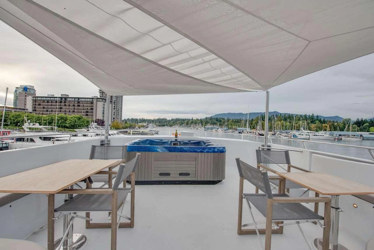 a room with tables and chairs aboard ASCENTE Yacht for Charter