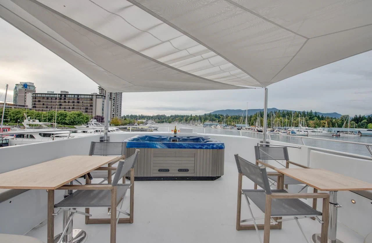 a room with tables and chairs aboard ASCENTE Yacht for Charter