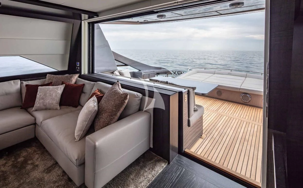 a couch and a bed on a boat aboard JUST 4 Yacht for Sale