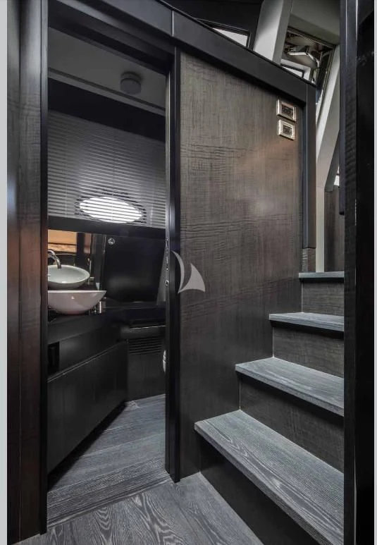 a bathroom with a sink and a mirror aboard JUST 4 Yacht for Sale