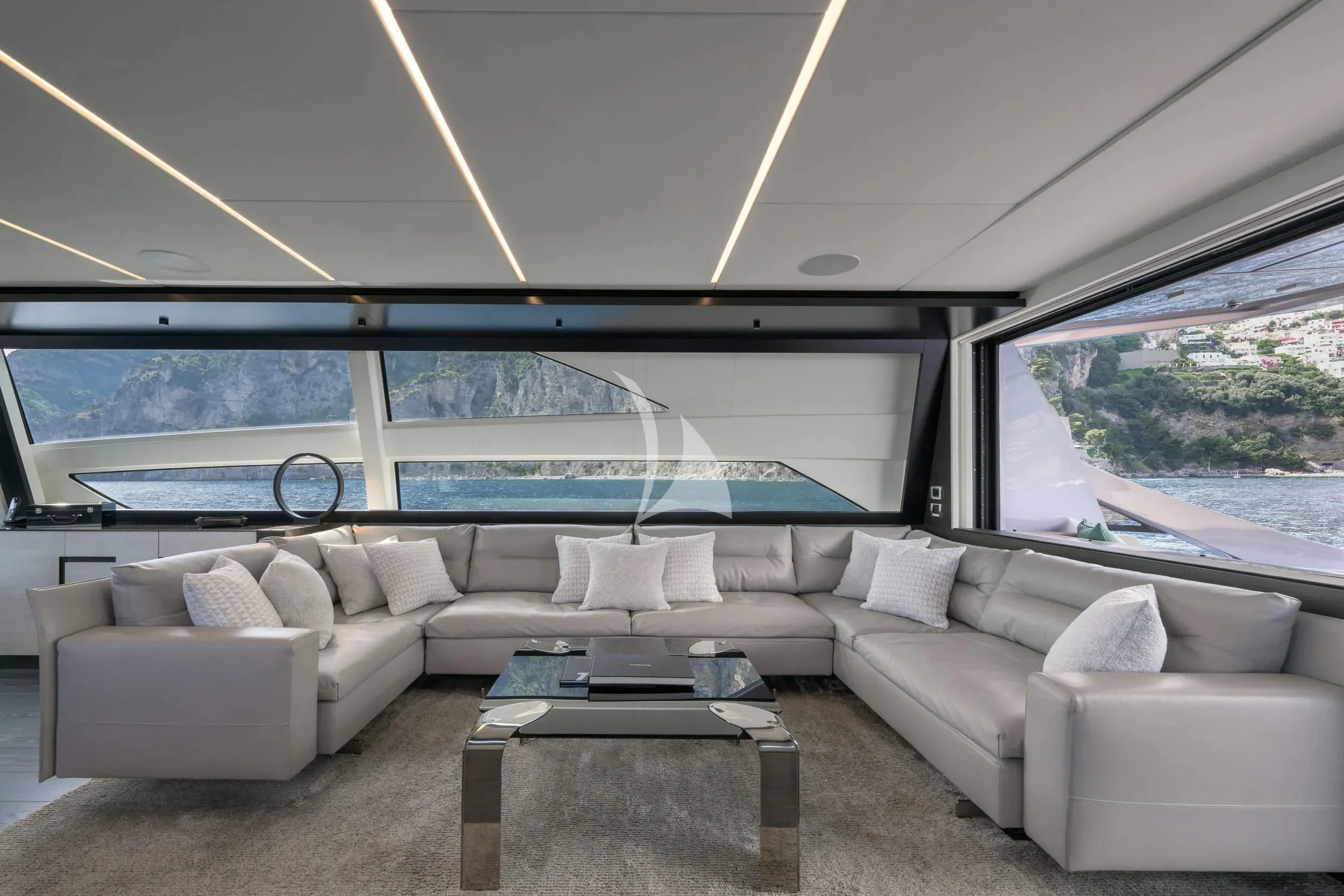a white couch in a room aboard JUST 4 Yacht for Sale