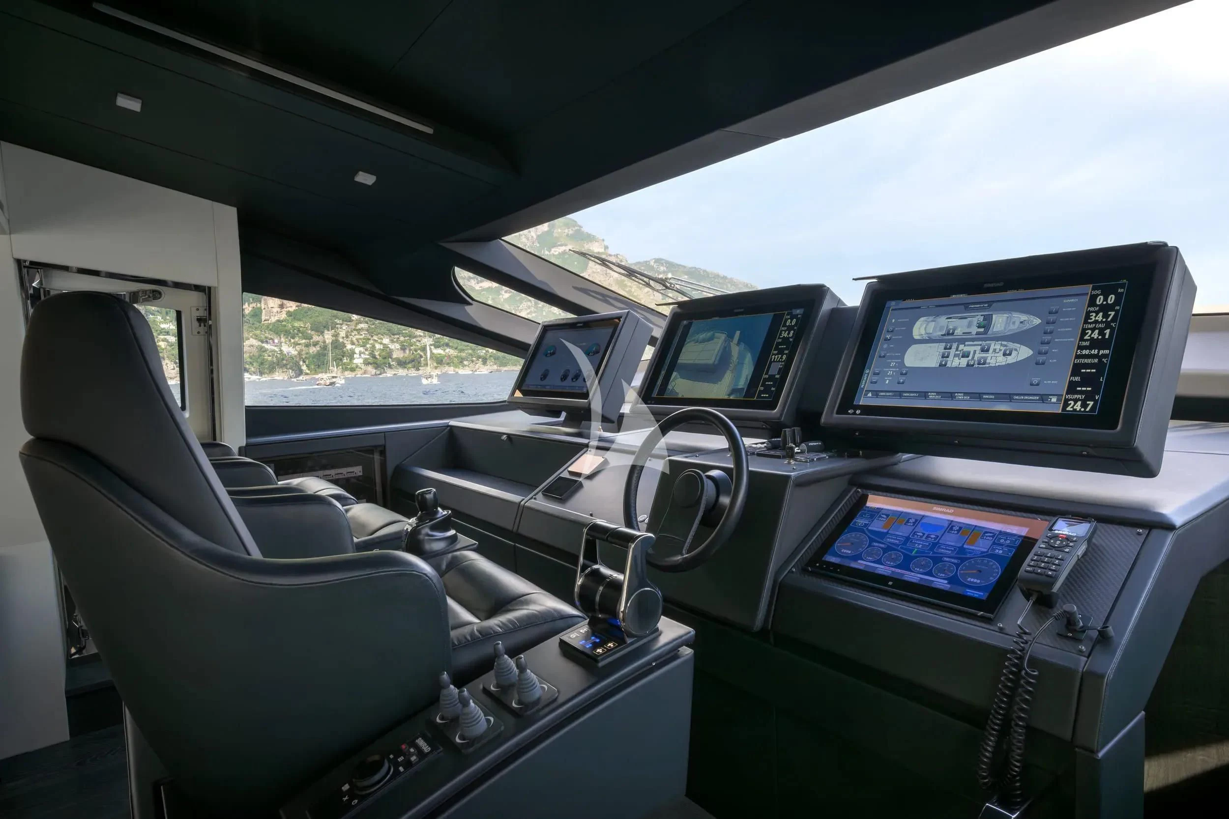 inside of a car with computers and monitors aboard JUST 4 Yacht for Sale