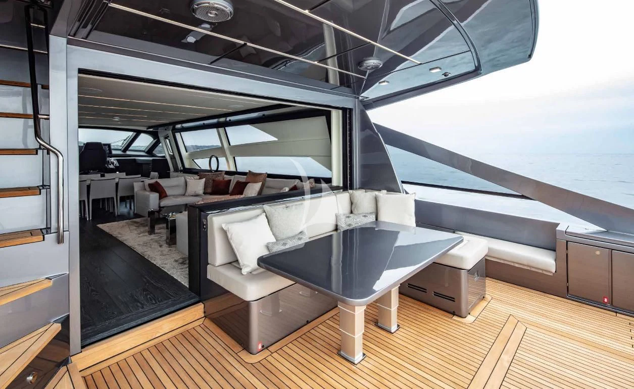 a room with a table and chairs aboard JUST 4 Yacht for Sale