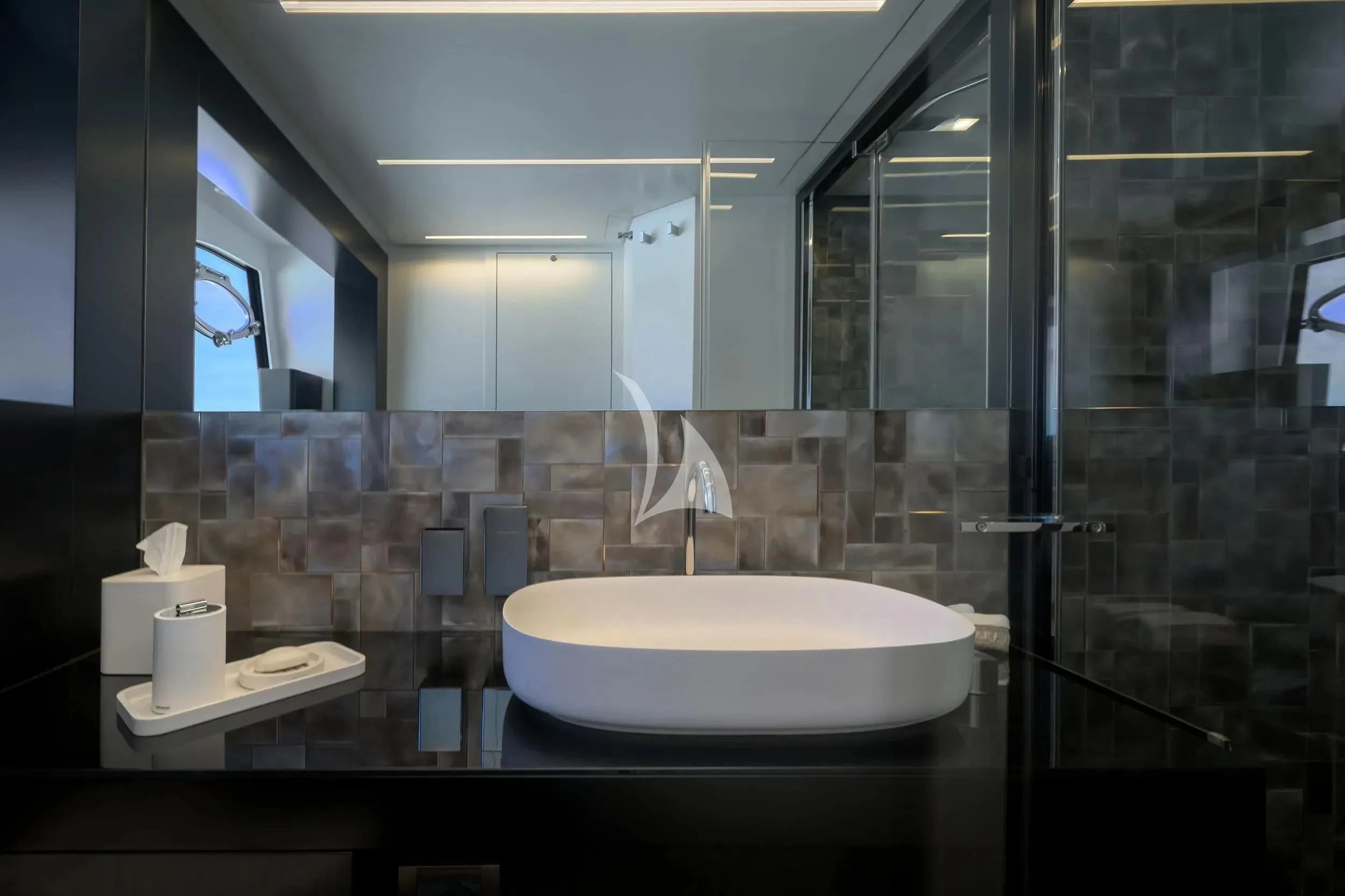 a bathroom with a large mirror aboard JUST 4 Yacht for Sale