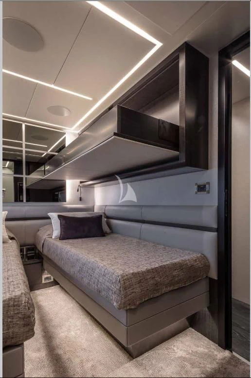 a room with a bed and a large mirror aboard JUST 4 Yacht for Sale