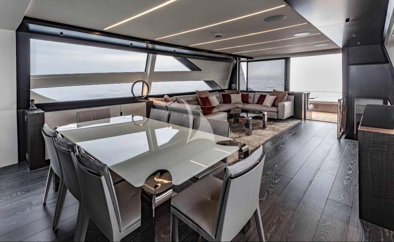 a large room with a large table and chairs aboard JUST 4 Yacht for Sale