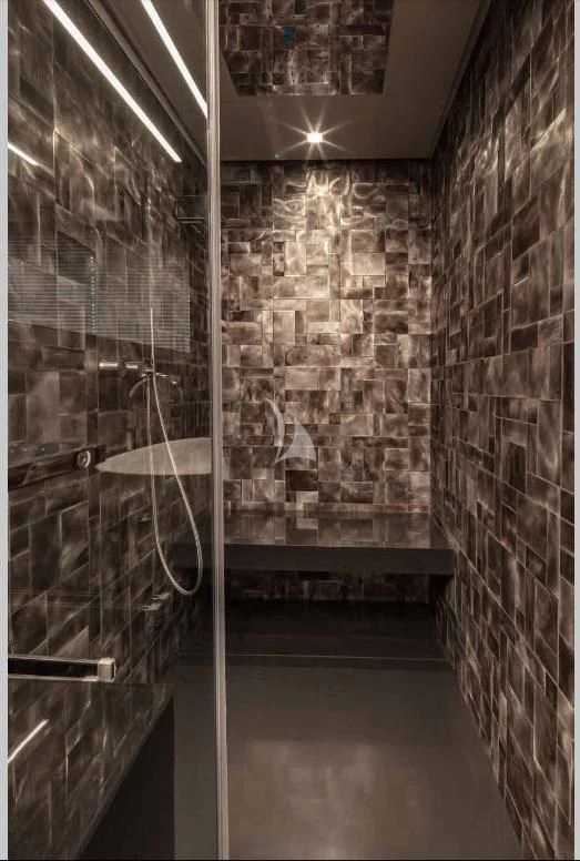 a room with a stone wall aboard JUST 4 Yacht for Sale