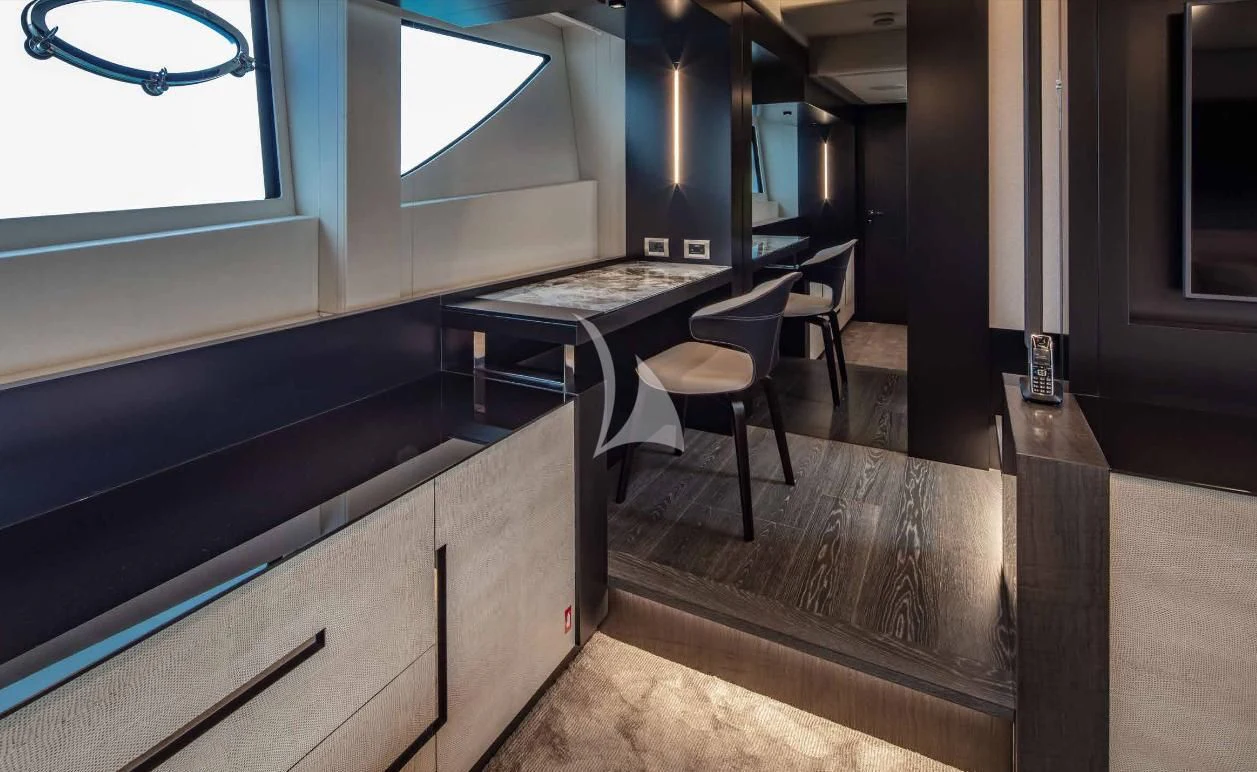 a room with a table and chairs aboard JUST 4 Yacht for Sale