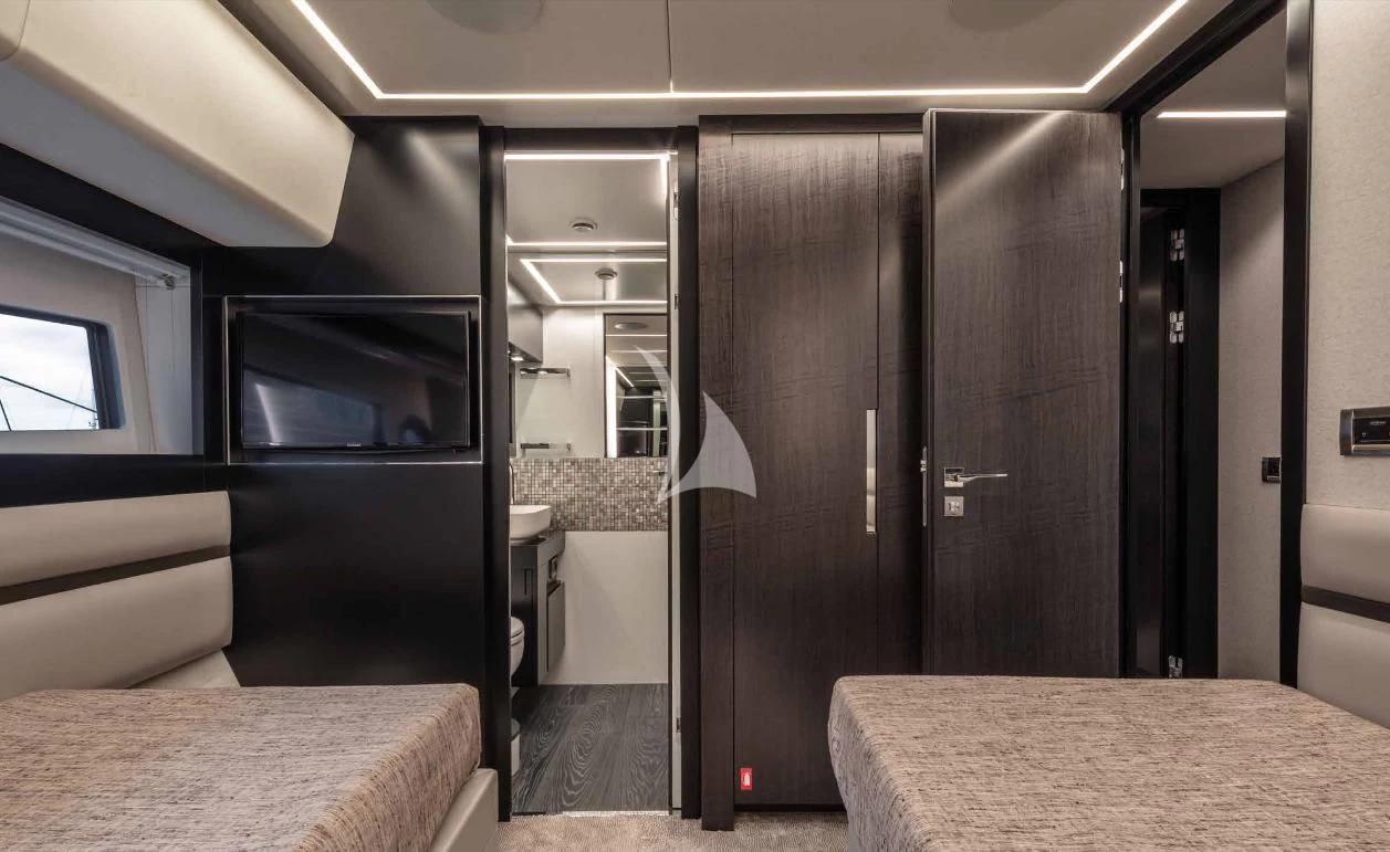 a room with a bed and a table aboard JUST 4 Yacht for Sale