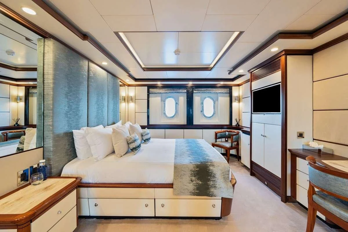 a bed in a room aboard TITIAN PEARL Yacht for Sale